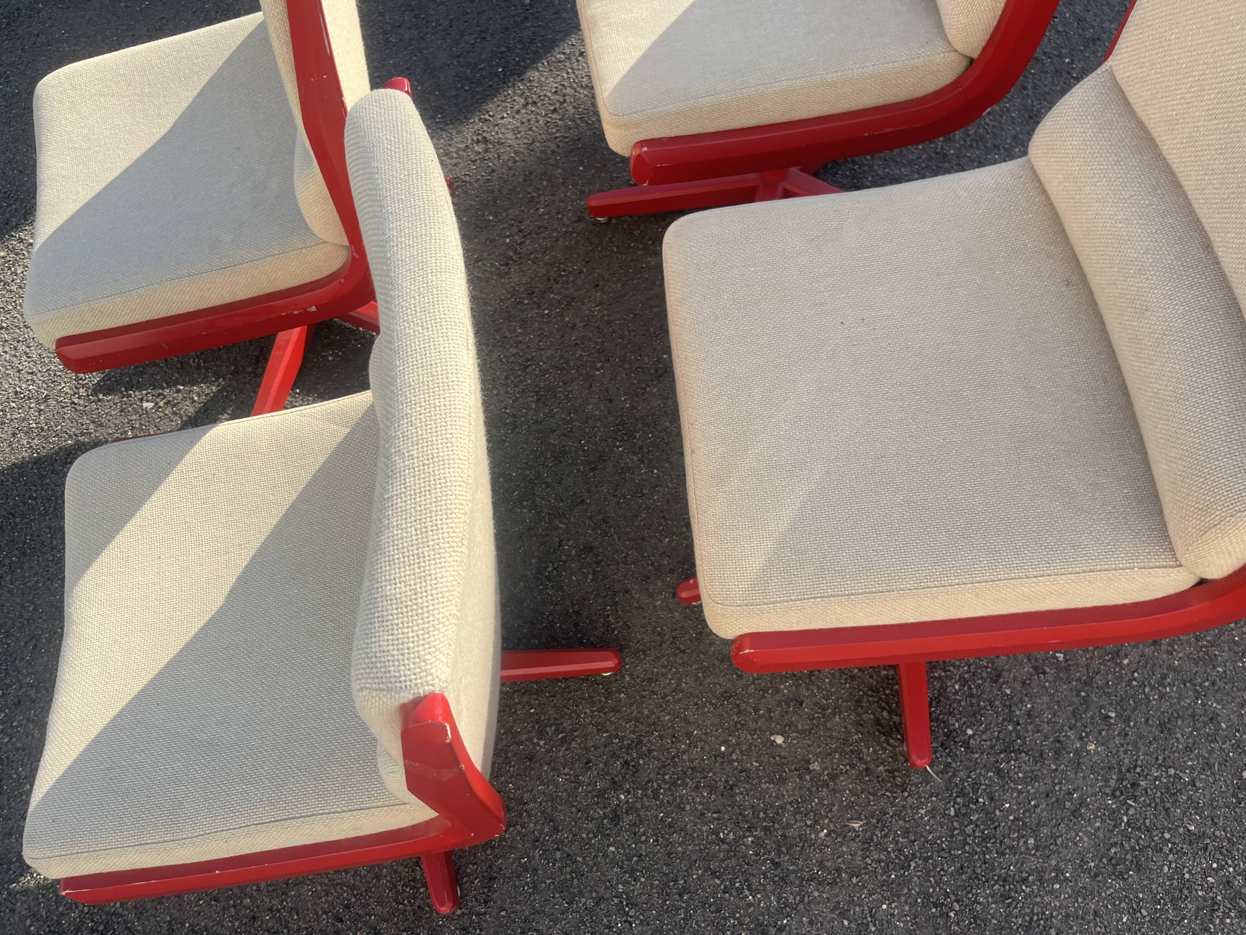 Set of 4 vintage 1970s swivel chairs in red and beige.
