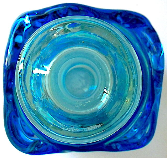 Blown blue glass bottle with inclusions