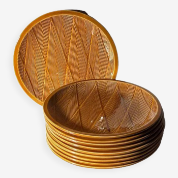 Ten plates in Salins slip with braided patterns 50s