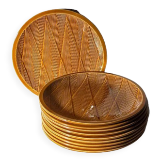 Ten plates in Salins slip with braided patterns 50s