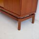 Modern mid-century teak sideboard with brass details.