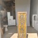 Rectangular Indonesian construction element with blue and yellow plant in carved wood