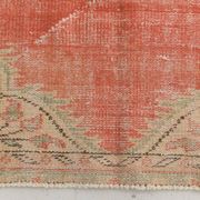 Tapis vintage rouge pâle