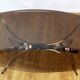 Italian coffee table in smoked glass and brass
