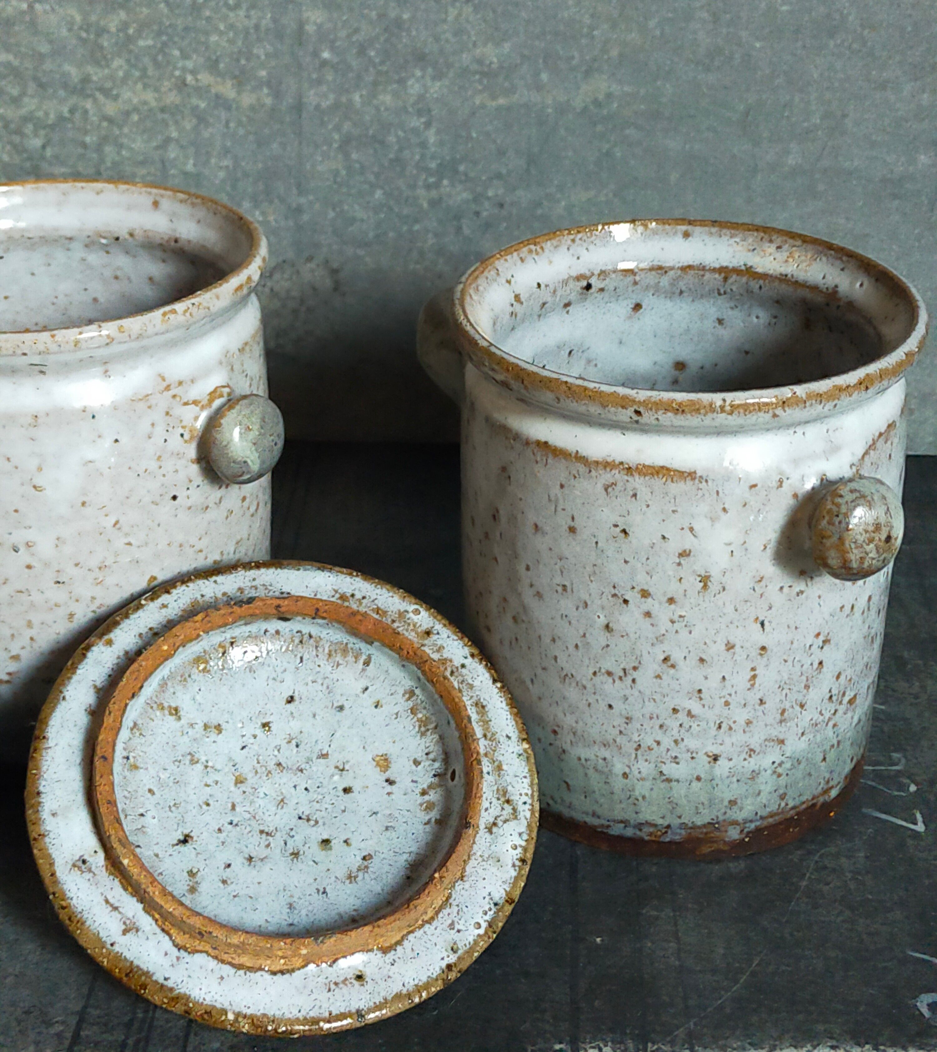 Duo of potter's pots covered in vintage glazed stoneware