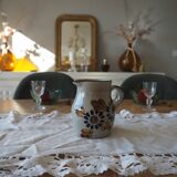 Small stoneware water pot with floral pattern