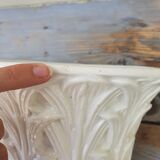 Important white earthenware pot cache with leafy decoration