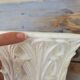 Important white earthenware pot cache with leafy decoration
