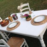 White farmhouse table set and four chairs