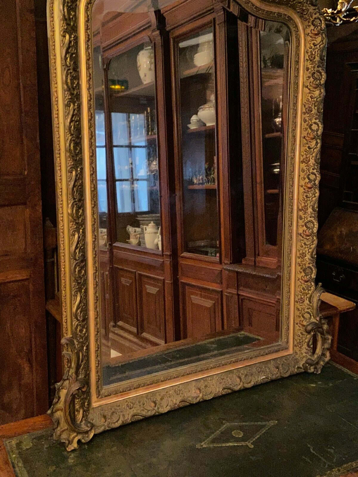 Golden mirror with bevelled ice pediment in Regency style