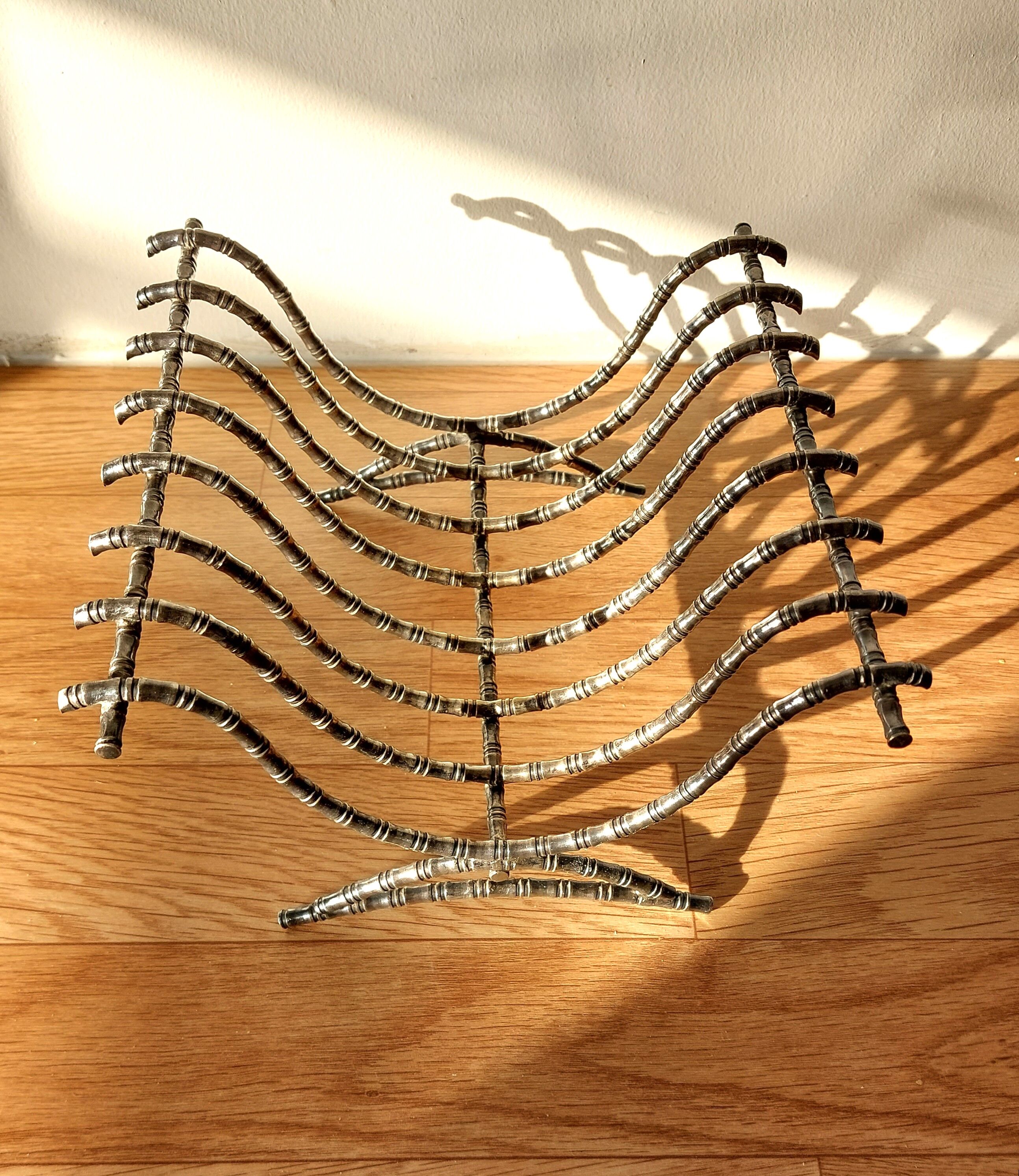 Silver metal cut in imitation of vintage bamboo.