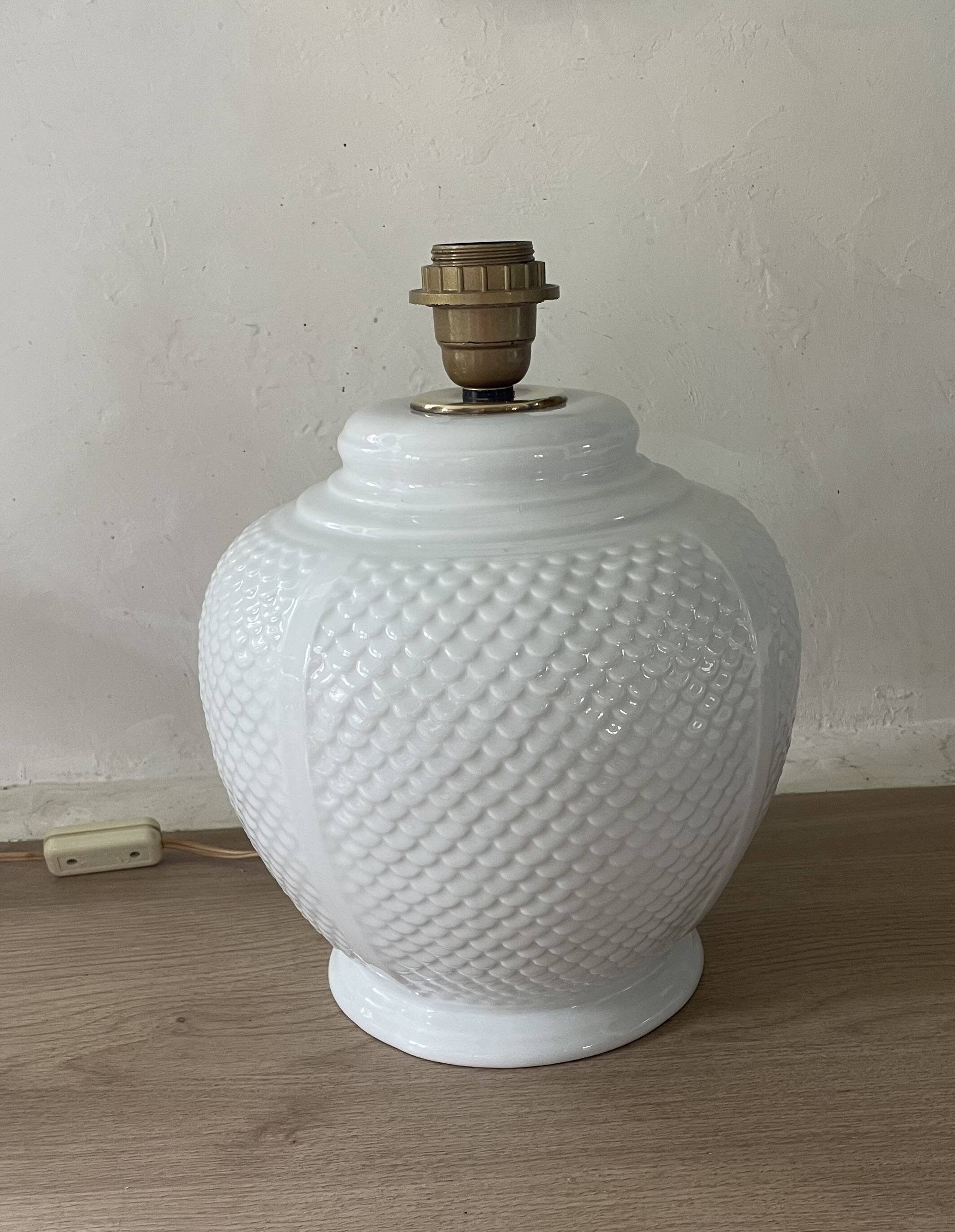 Vintage ceramic lamp with glazed scale patterns.