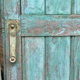 Pair of old wooden shutters green mint color