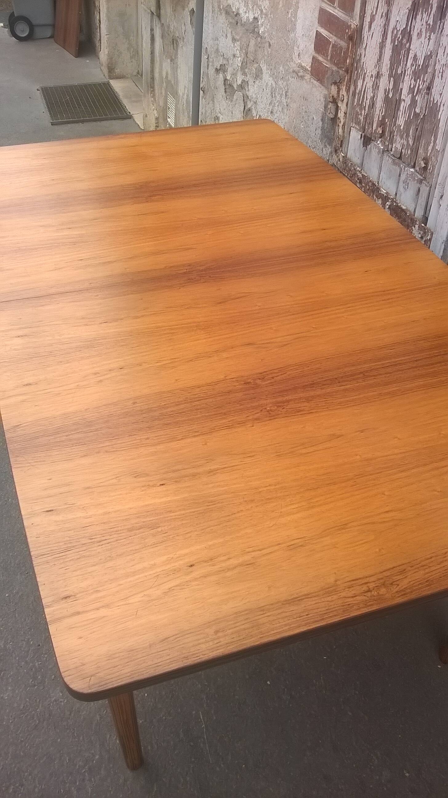 Extendable teak dining table