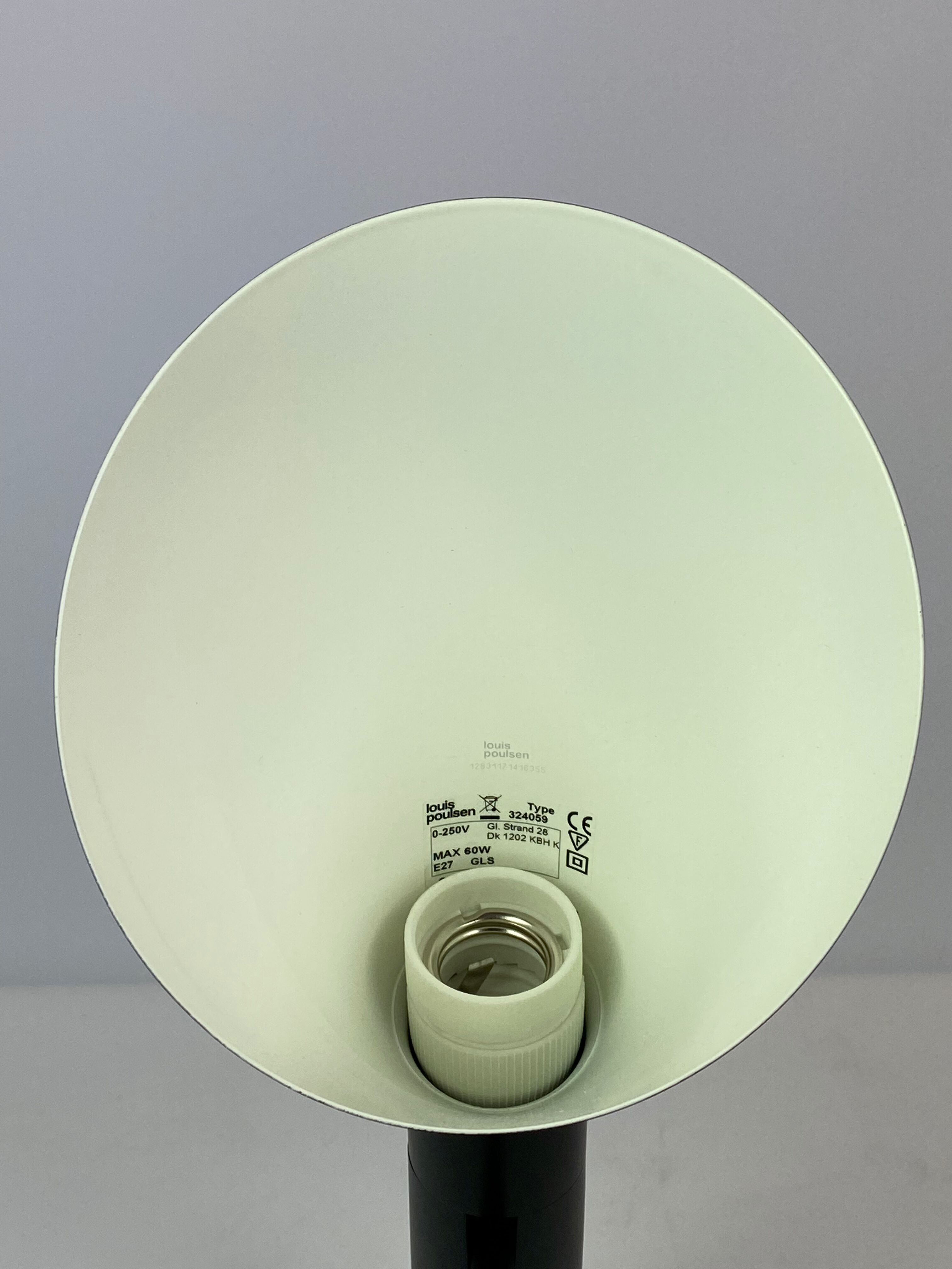 Black table lamp designed by Arne Jacobsen and manufactured by Louis Poulsen