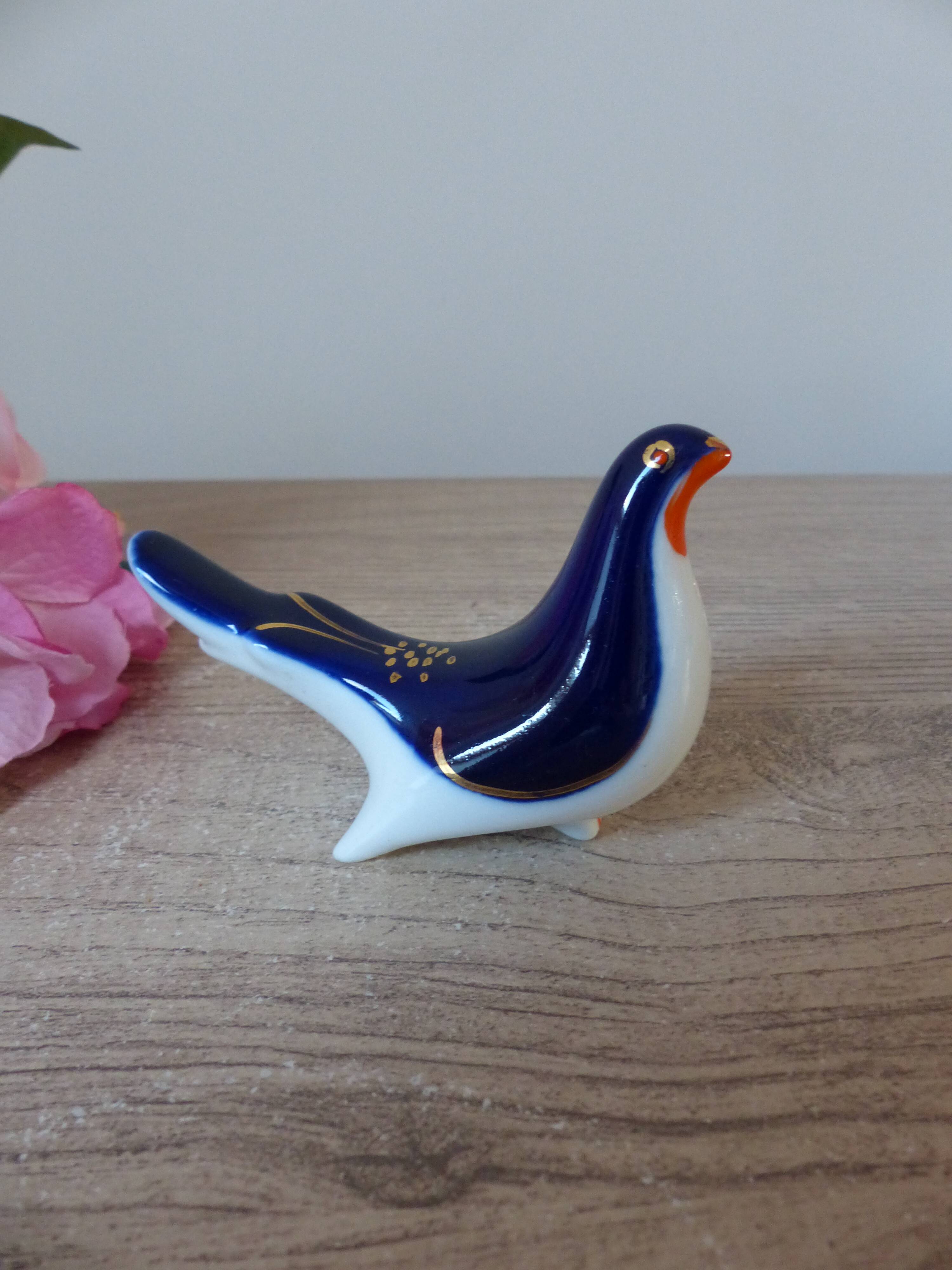 Vintage Soviet salt and pepper shaker in the shape of a cobalt blue bird.