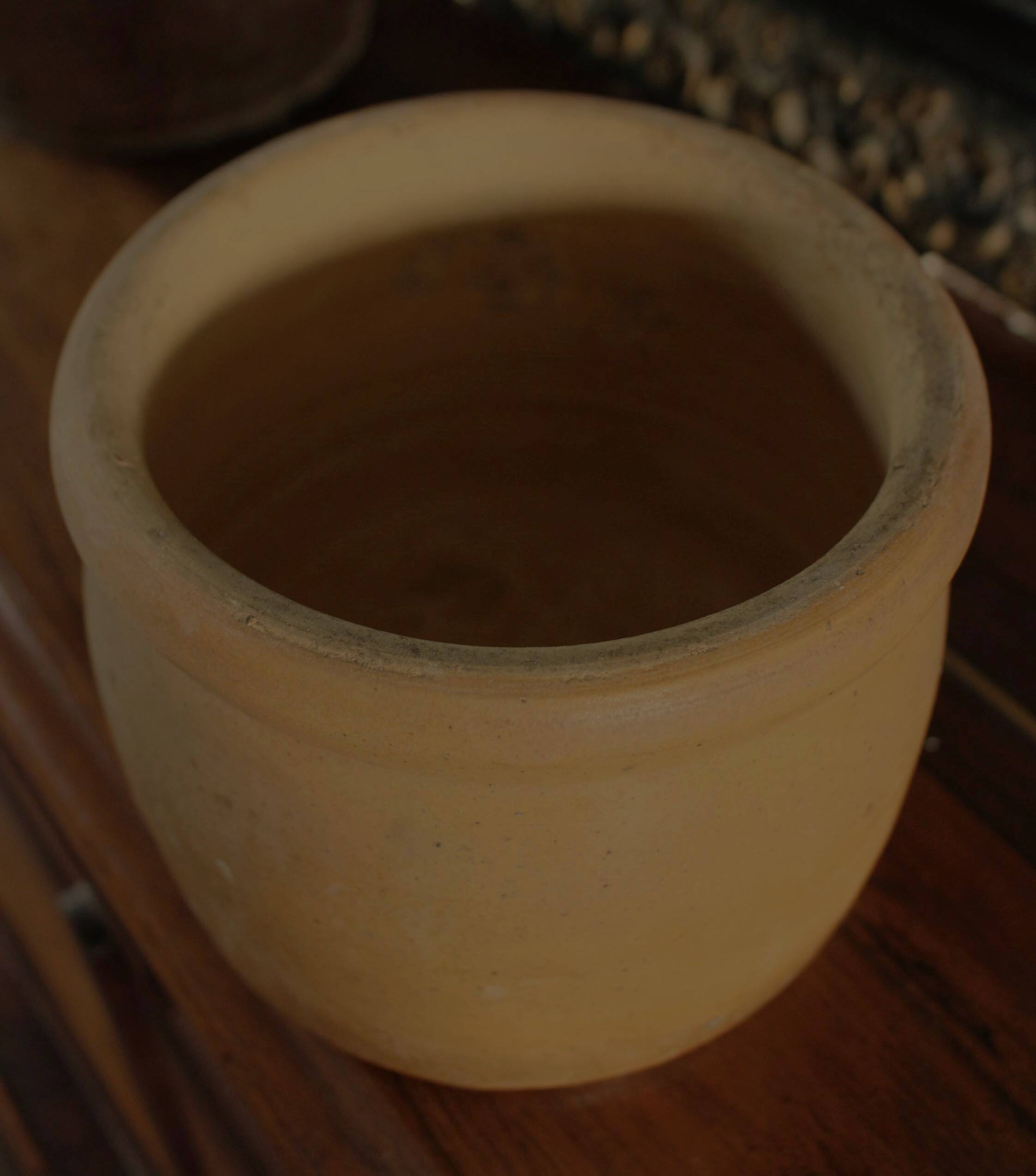 Round terracotta milk jug with handle