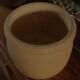 Round terracotta milk jug with handle