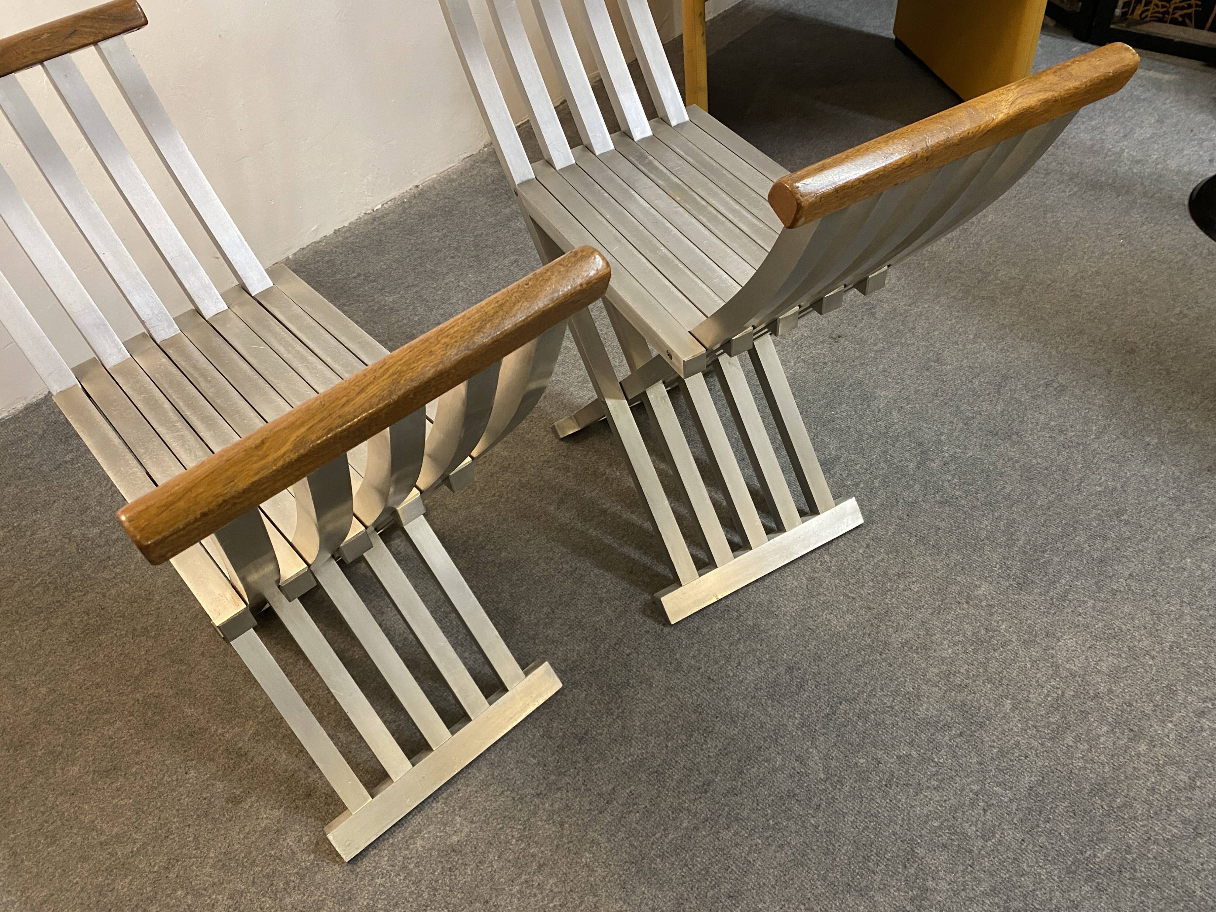 Pair of curule chairs designed by John Vesey, 1958, USA, brushed aluminum, walnut and leather