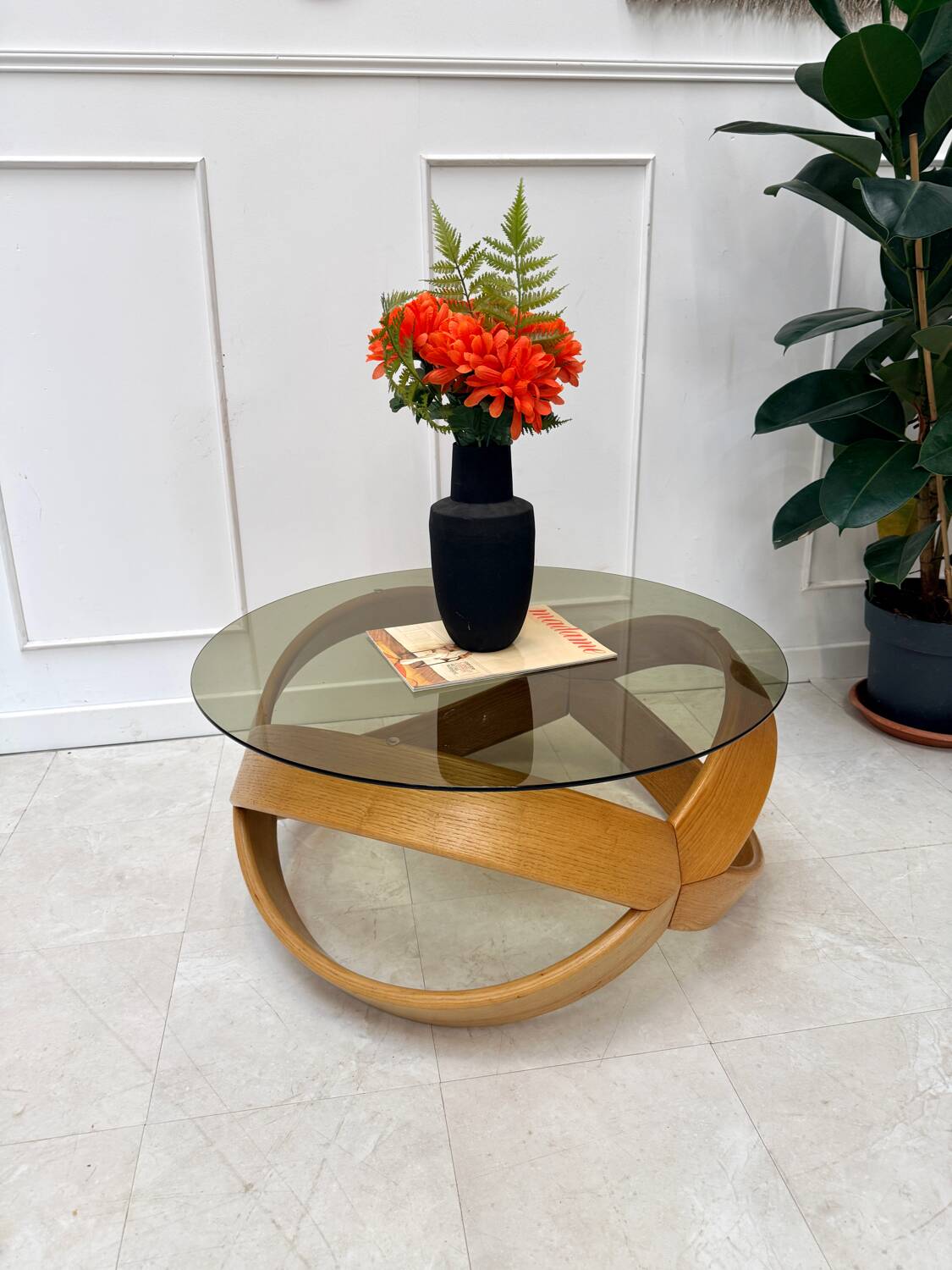 Smoked glass and curved wood coffee table