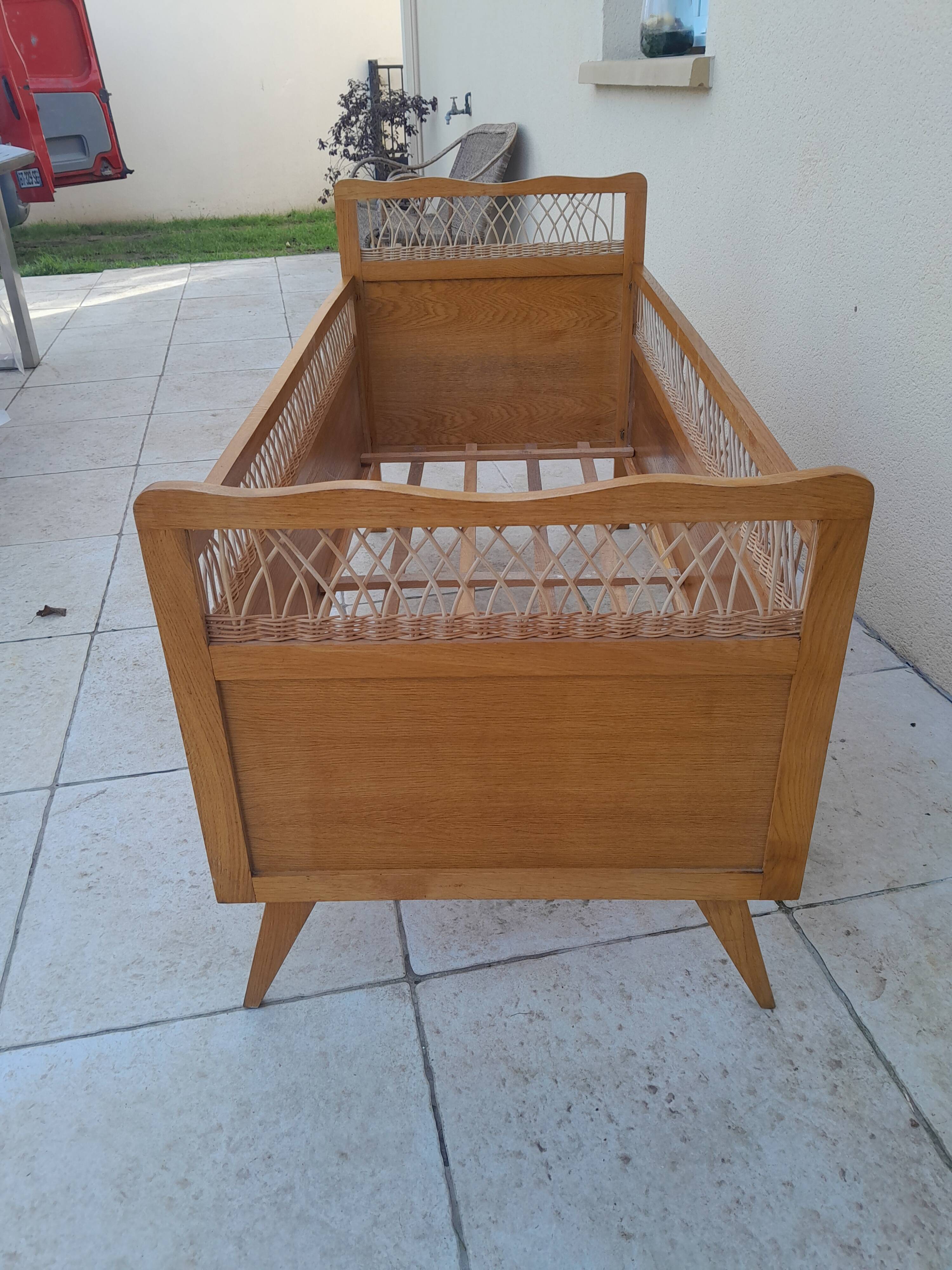 Vintage baby bed in wood and rattan from the 60s for children