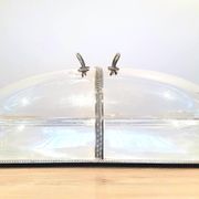 Large serving platter with lid, in silver metal.