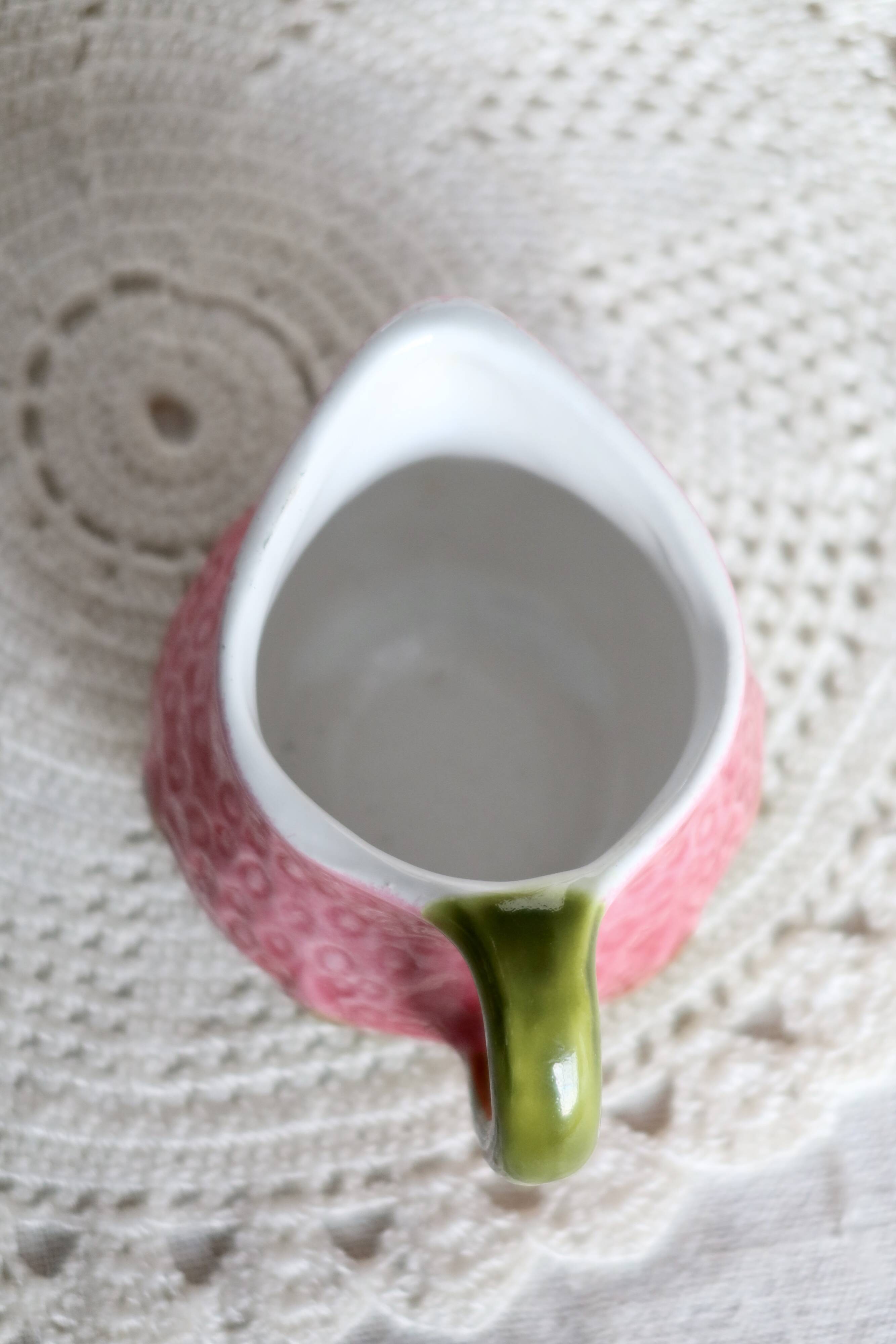 Vintage milk jug in Italian faience majolica.