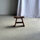 Small stool with a curved seat in Asian teak H36 W21
