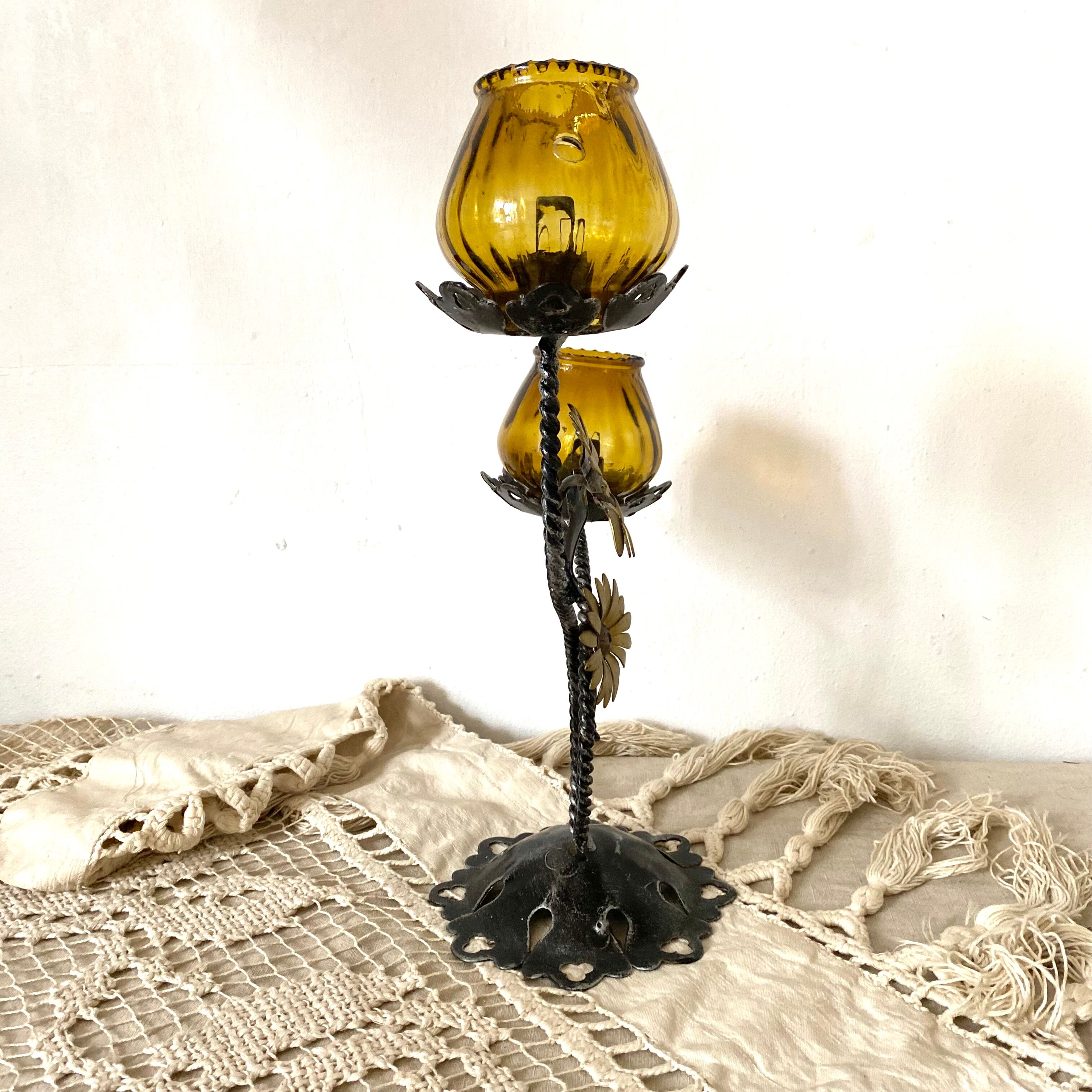 Double candle holder in metal and amber glass
