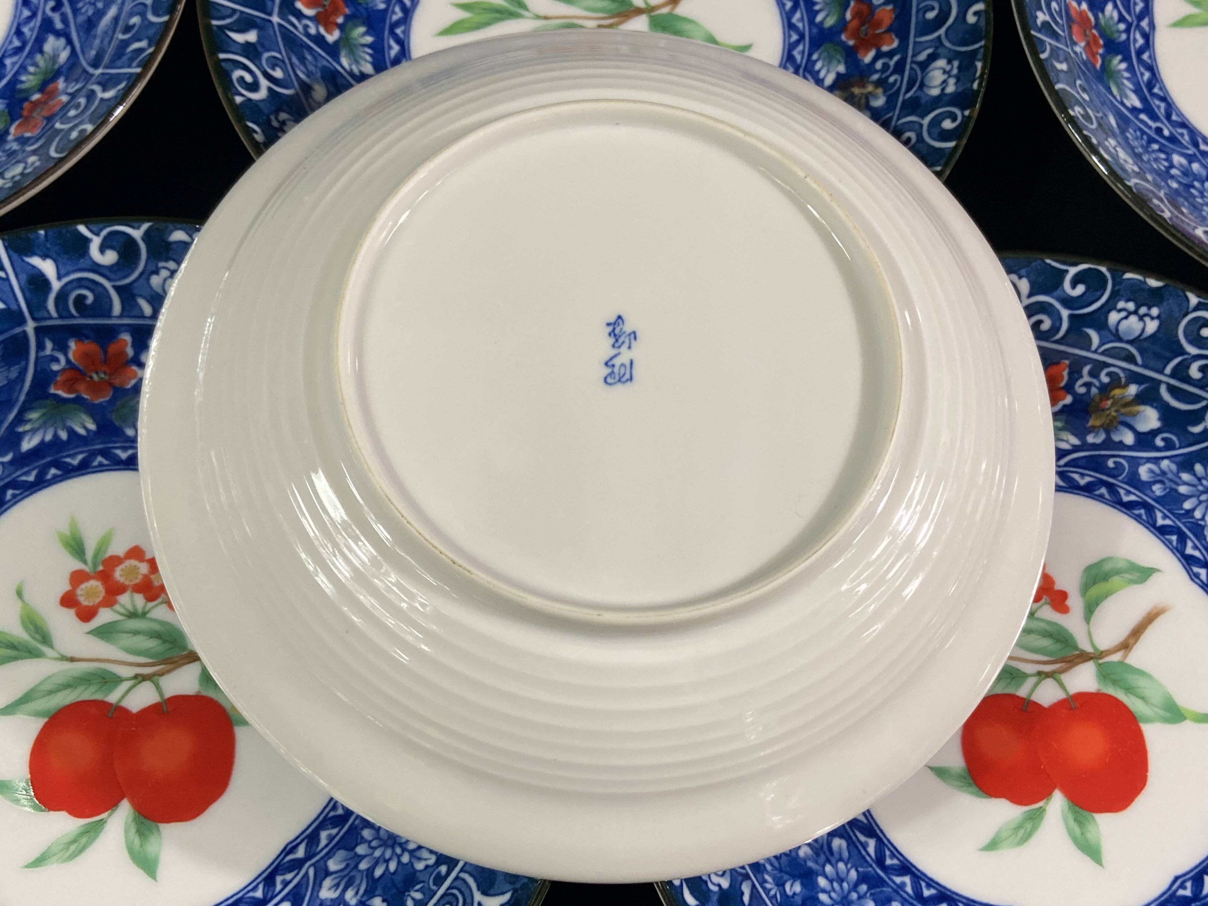 Set of 10 signed porcelain dessert plates with fruit decoration