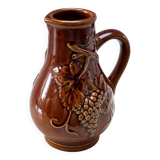 vintage ceramic pitcher with grape and vine decor