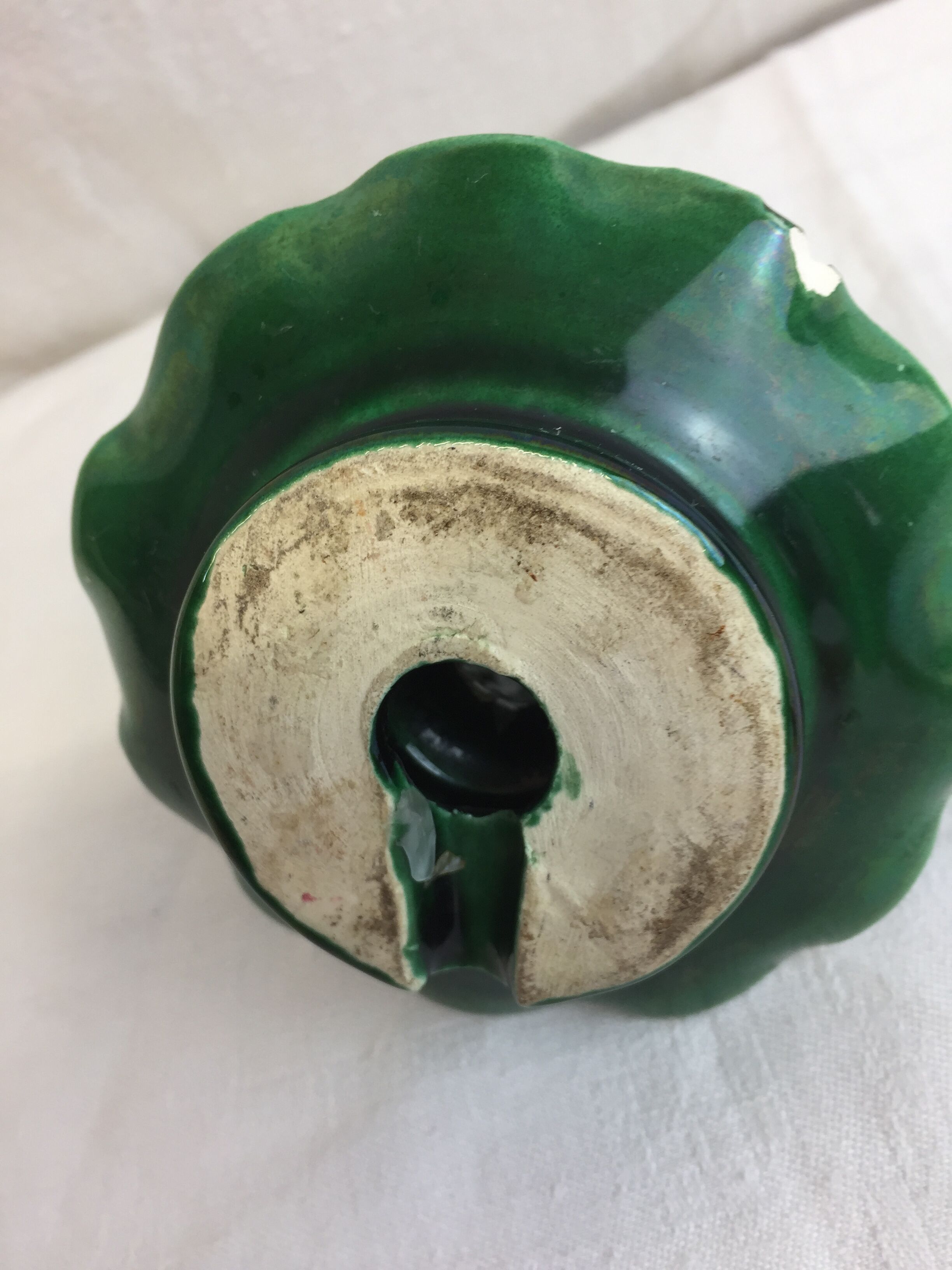 Old candleholder, glazed terracotta cellar, artisanal green color