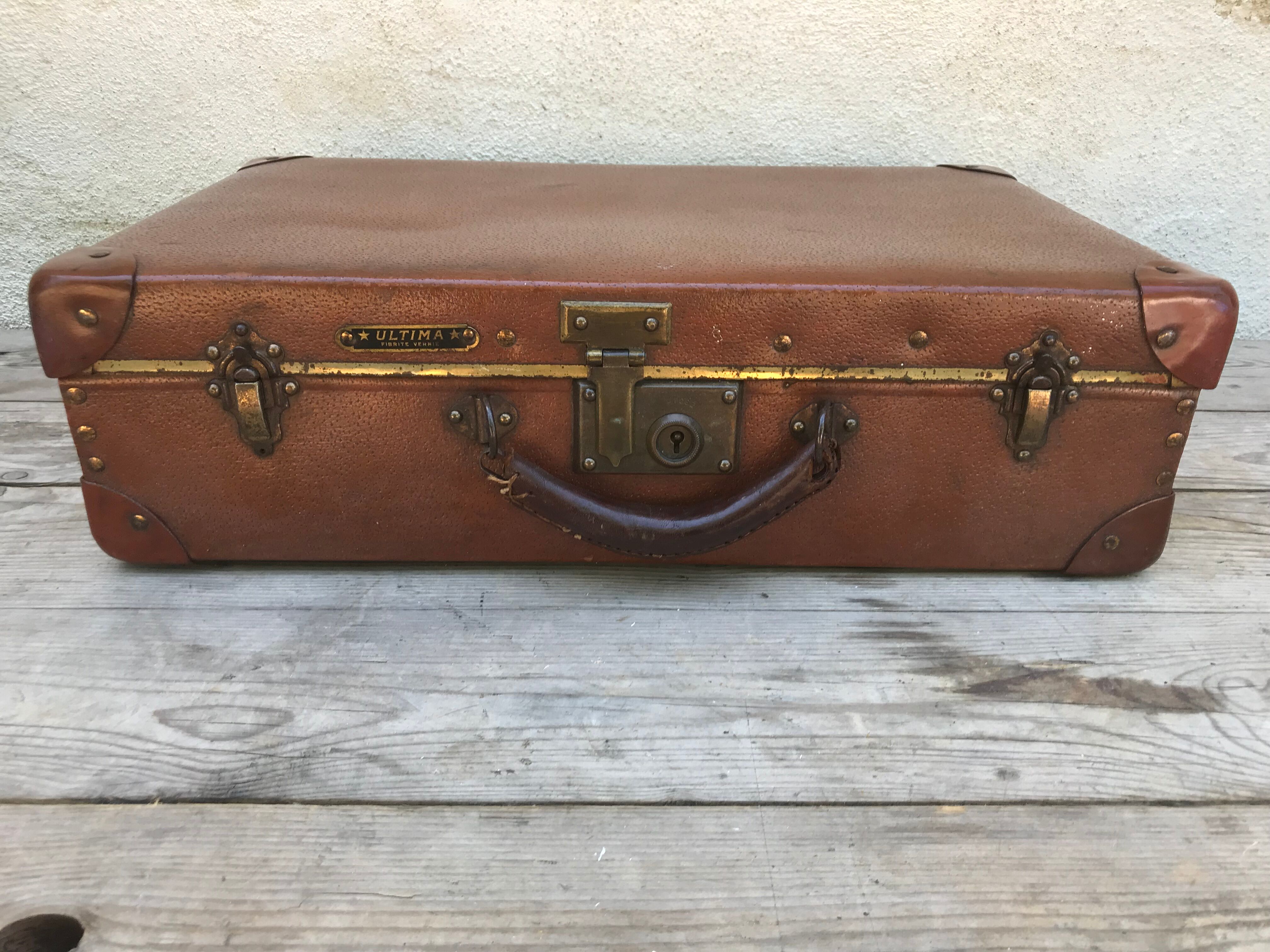 Old suitcase travel ultima brown fiber trunk