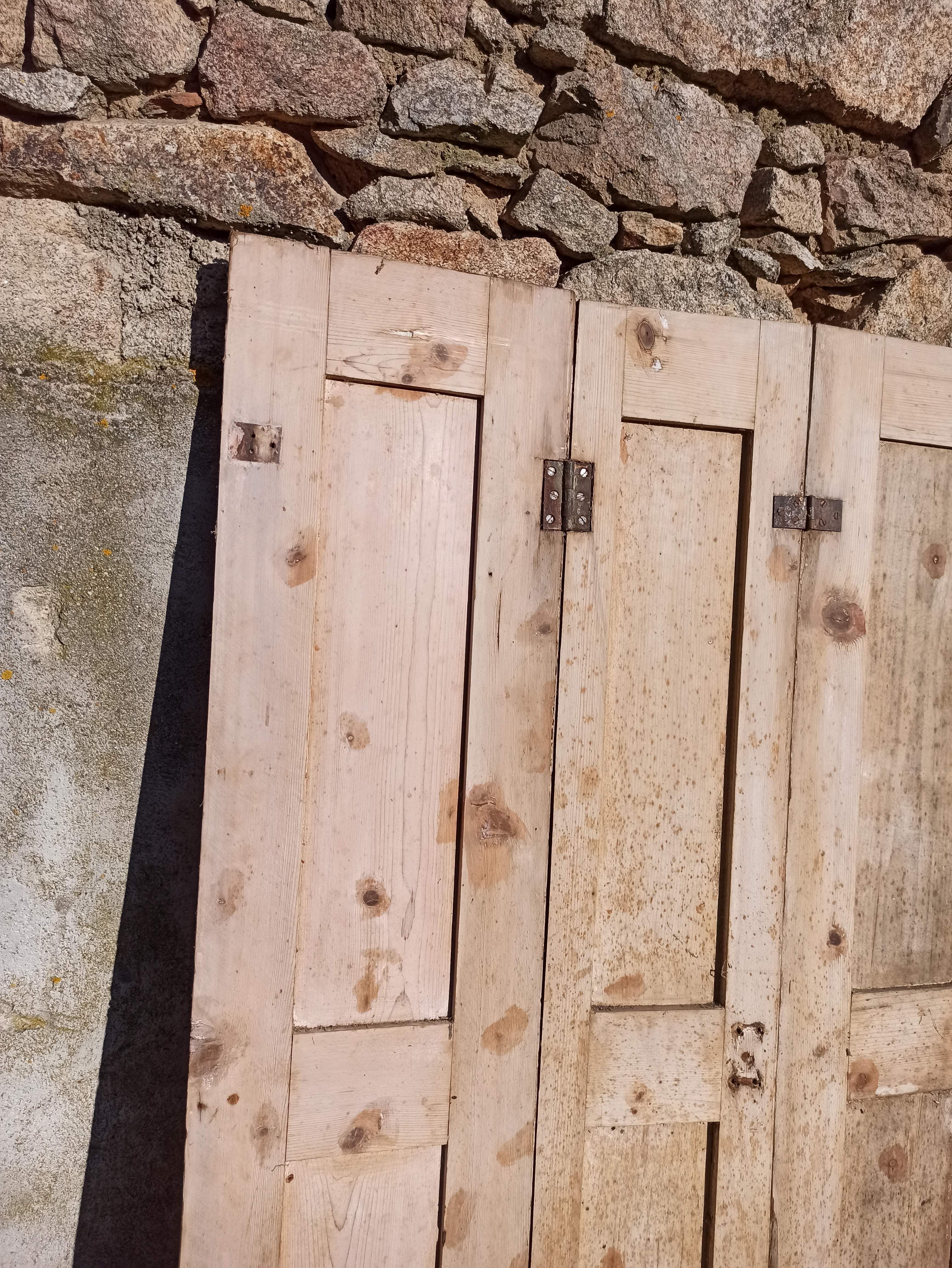 Old trio of wooden screen doors