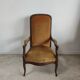 Fauteuil Voltaire garniture de velours jaune