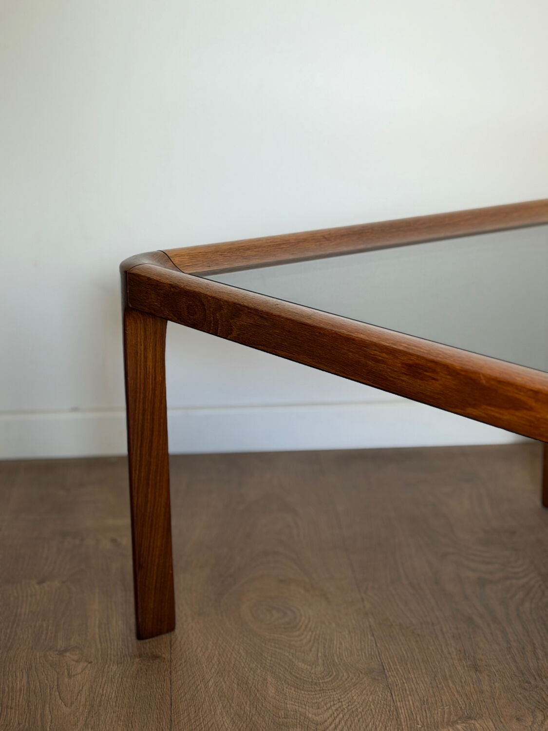 Large Scandinavian coffee table in teak and smoked glass.