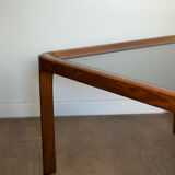 Large Scandinavian coffee table in teak and smoked glass.