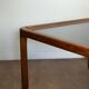Large Scandinavian coffee table in teak and smoked glass.