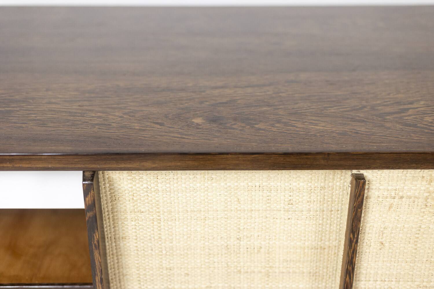 Sideboard in wenge, raffia and lacquered metal. 1970s.