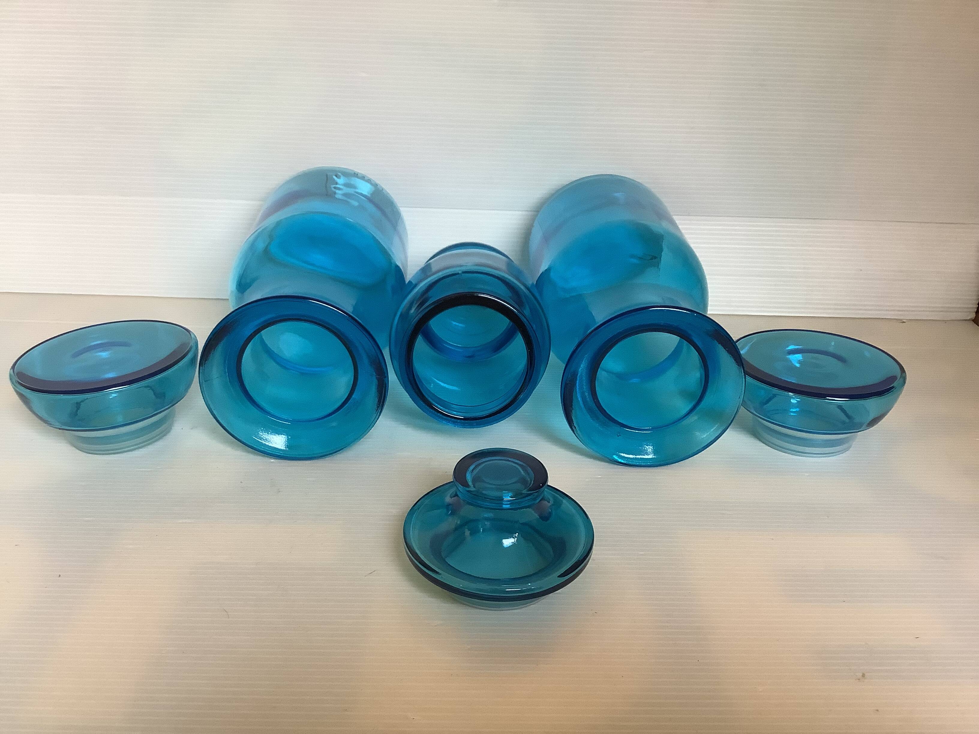 Trio of blue glass candy jars from the 70s