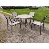 Garden furniture in stone with a vintage 1970s iron base.