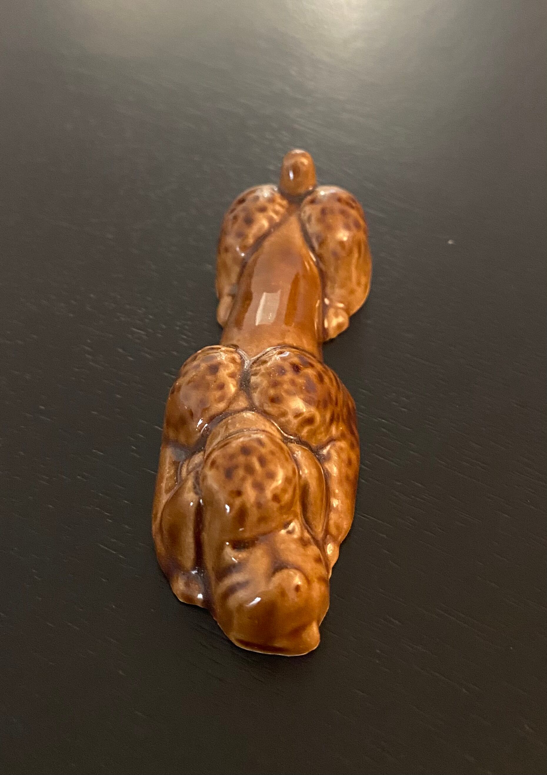 10 ceramic knife holders in the shape of a recumbent poodle