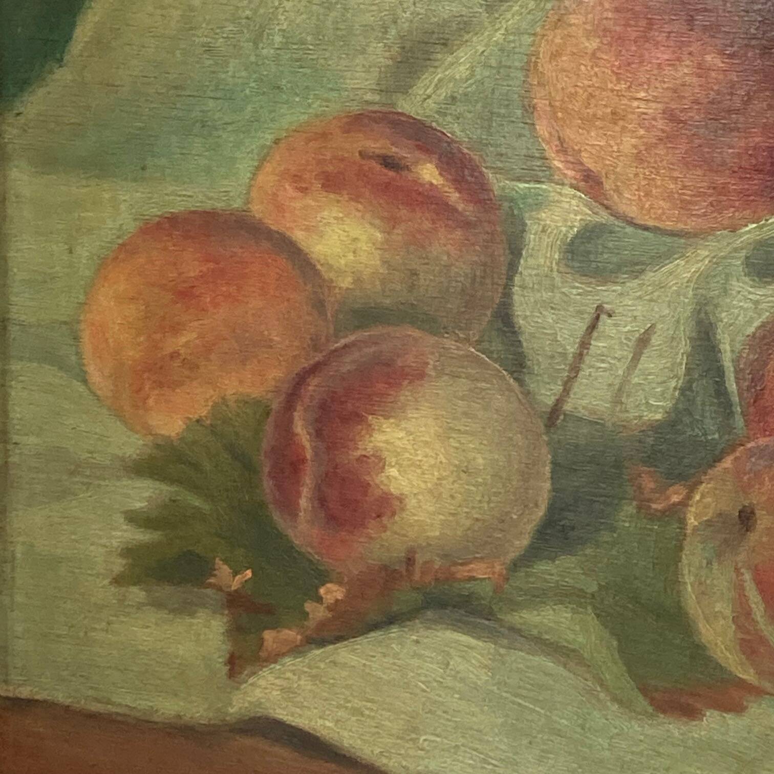 Still life depicting peaches on a cloth