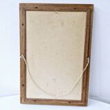 Canvas under vintage pink frame on black background