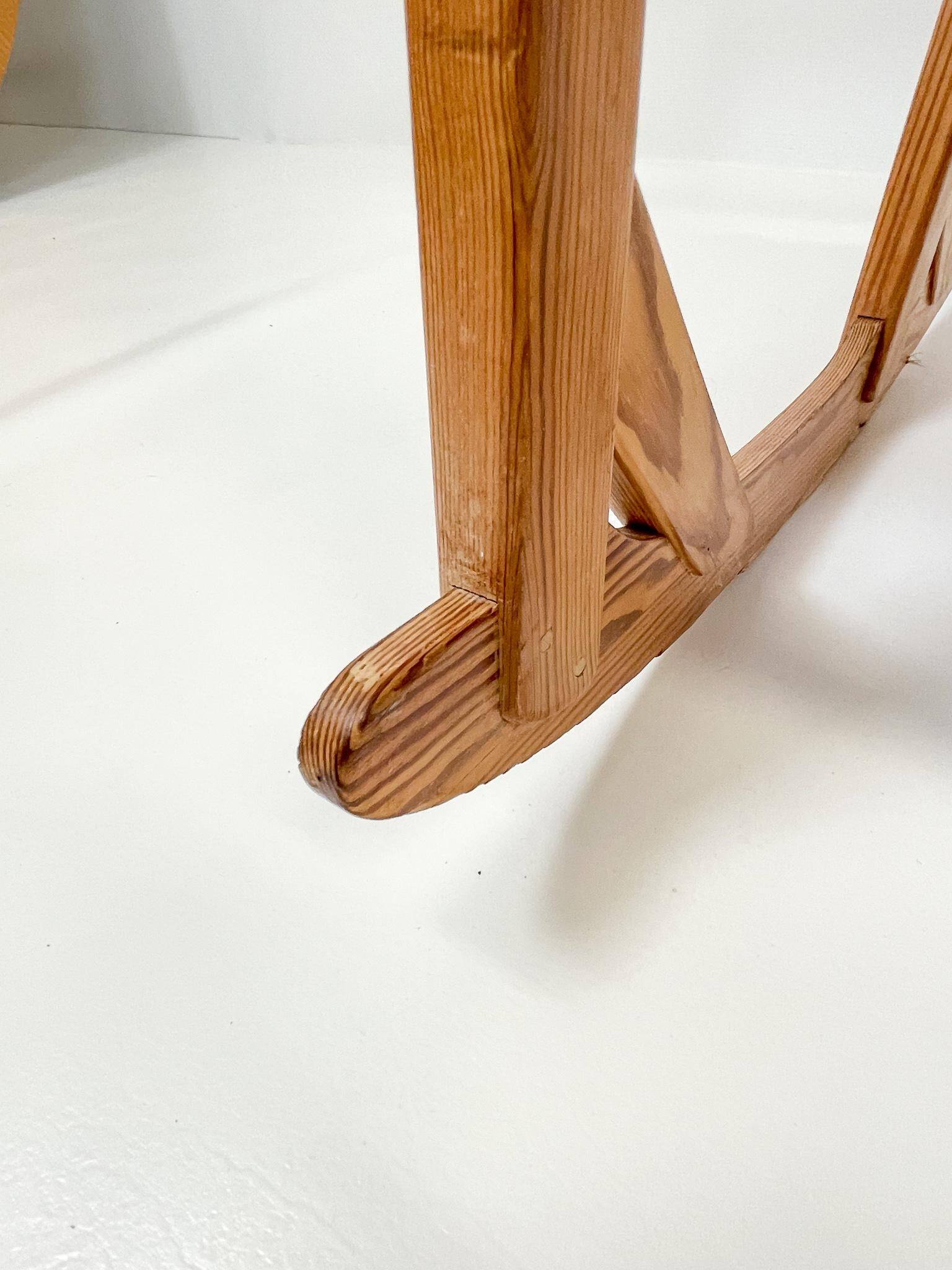 Mid-century rocking chair in pine and sheepskin by Yngve Ekström, Sweden.