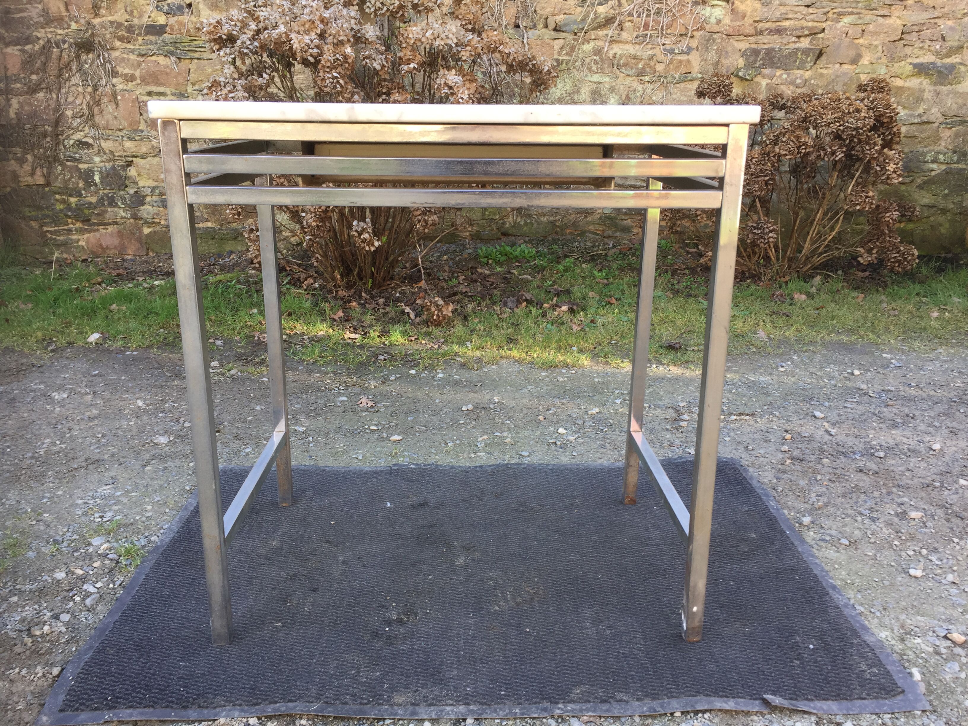 Vintage table with square chrome tubular metal base and marble top.