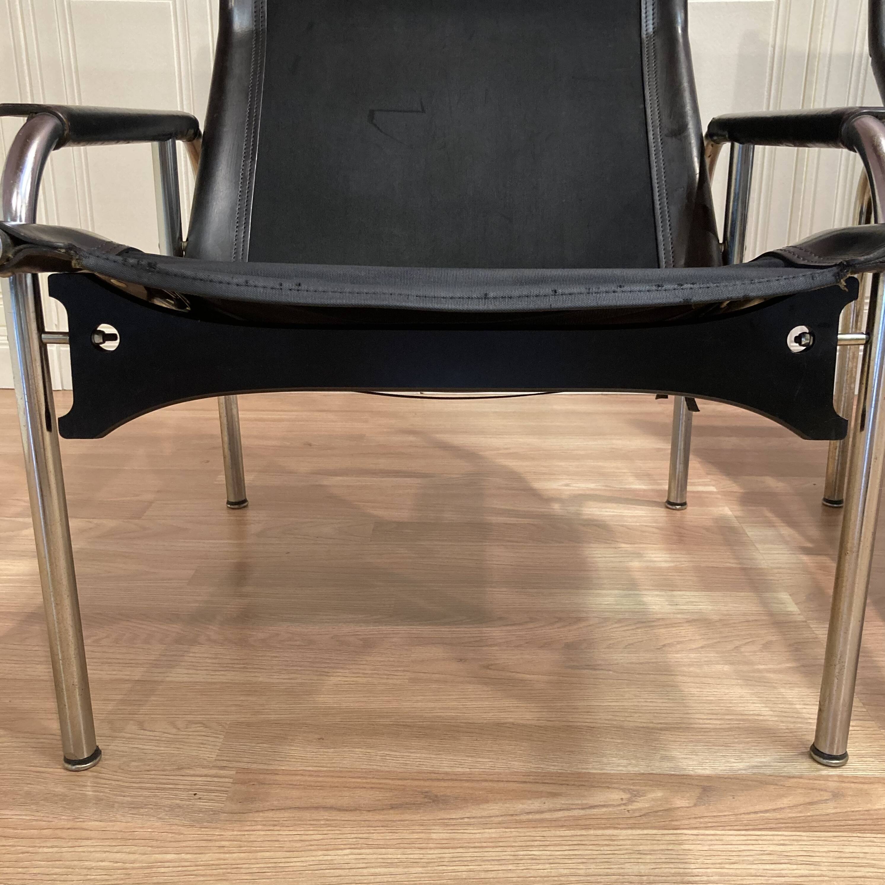 Set of 2 black leather and chrome relax armchairs "hans eichenberger" design