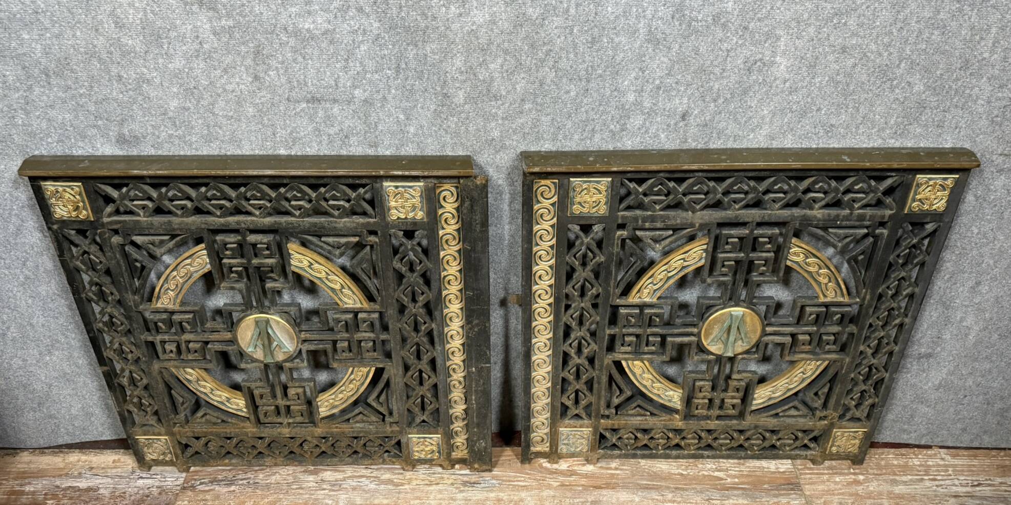 pair of monogrammed cast iron doors from the Art Deco period