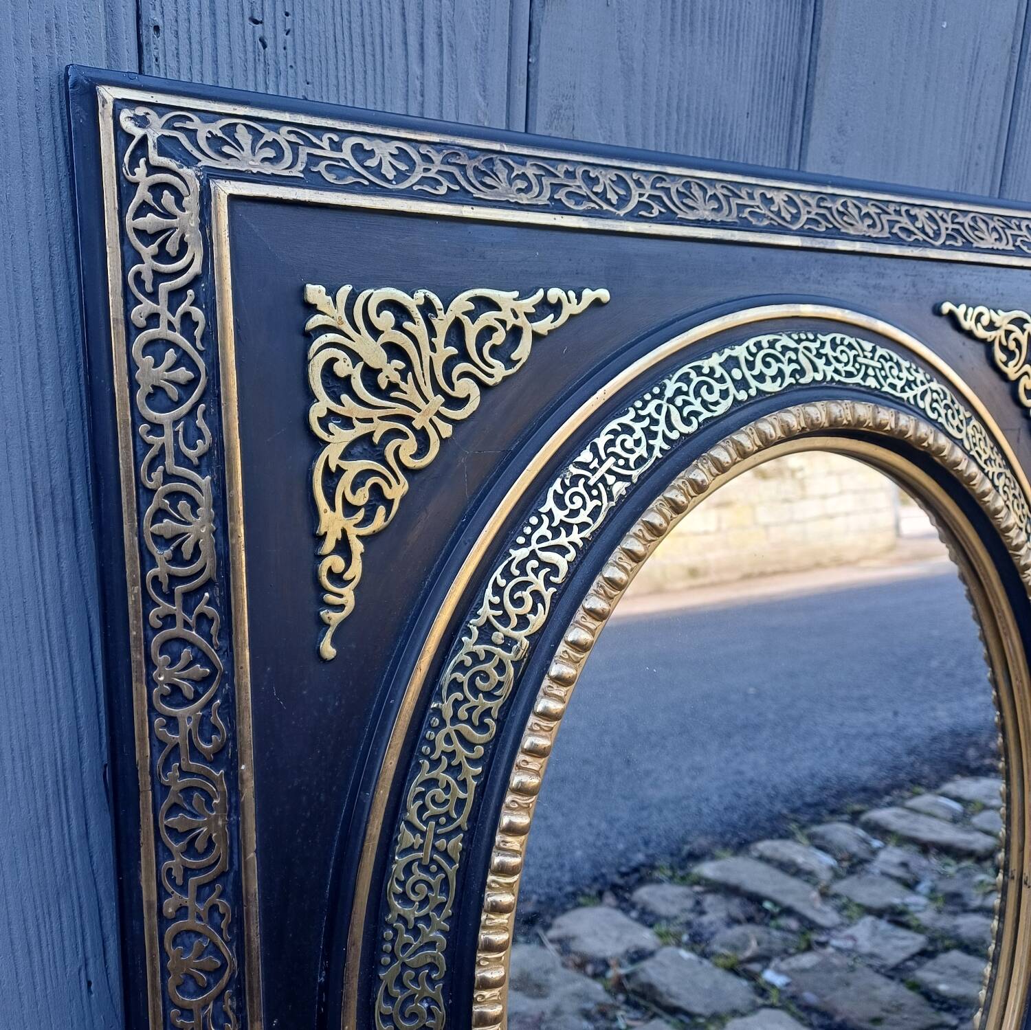 Pair of antique mirrors from the Napoléon III period, black and gilded.