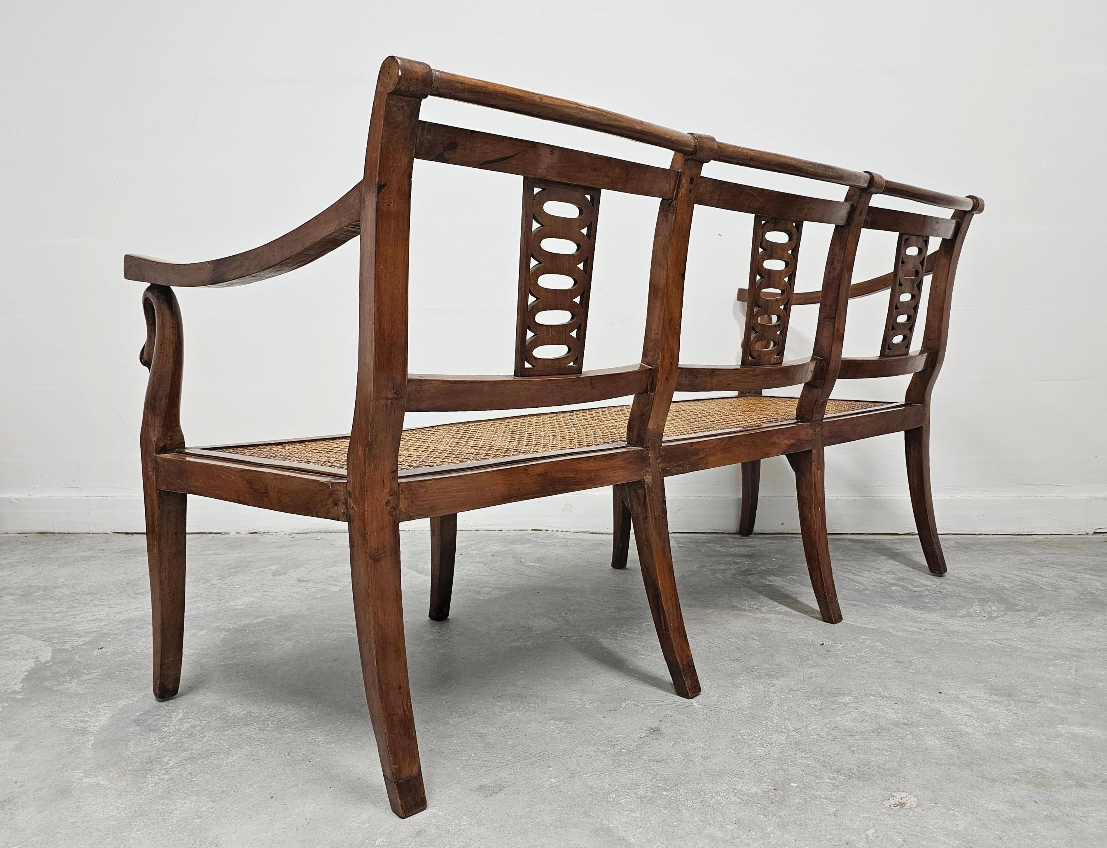 Directoire canapé in walnut with brass inlays, late 18th century.